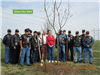 Friends and family gather near the tree planted for Arbor Day 2014 in honor of Sgt. Alex Funcheon.