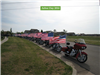 Motorcycles line the street with American Flags during the 2014 ceremony.
