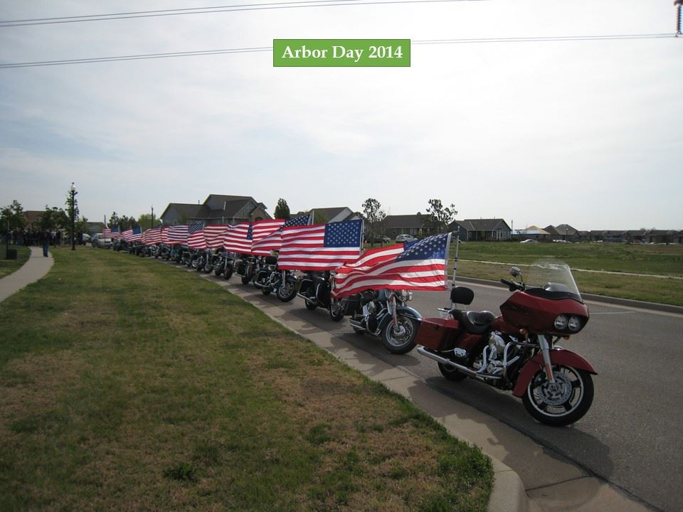 Motorcycles line the street with American Flags during the 2014 ceremony.