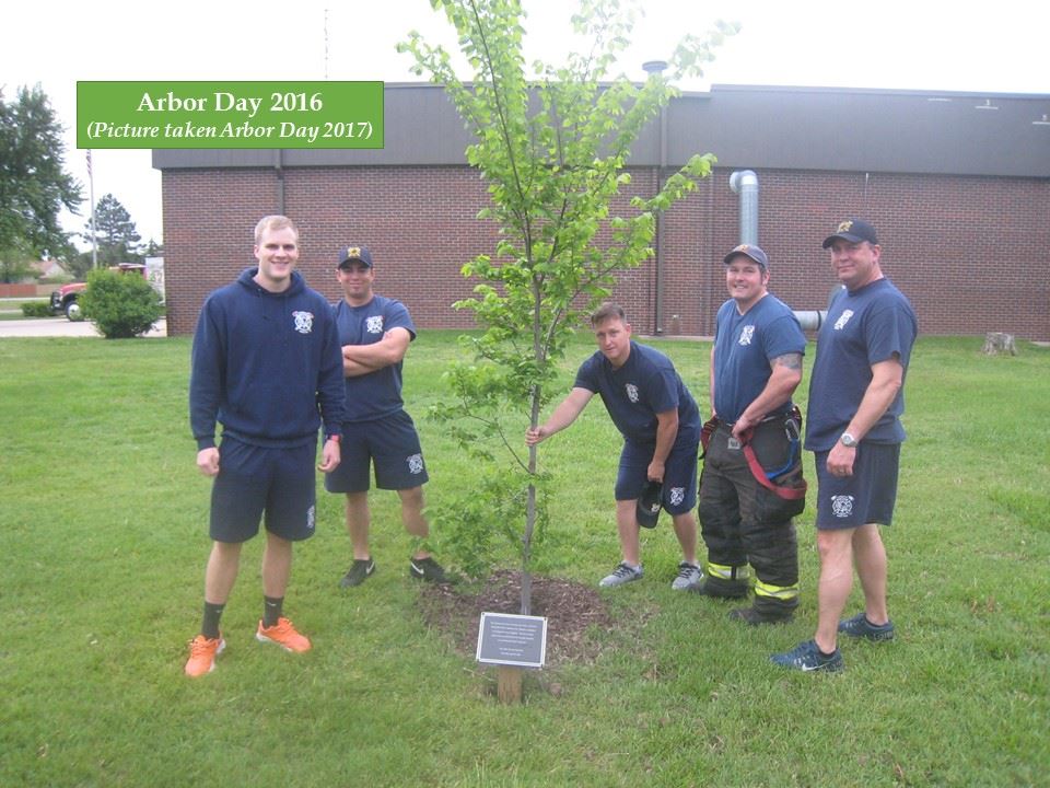 Sedgwick County Fire stands near newly planted tree at fire station #37 for Arbor Day 2016.