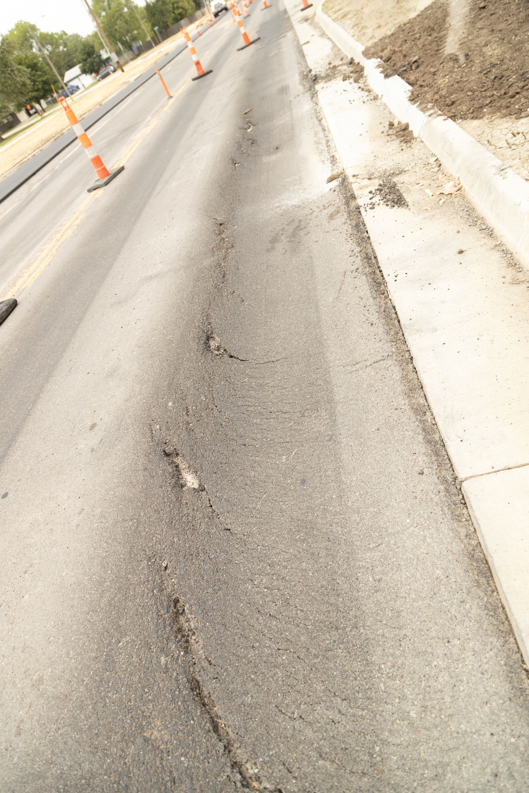 Defects during Woodlawn construction showing large cracks and potholes