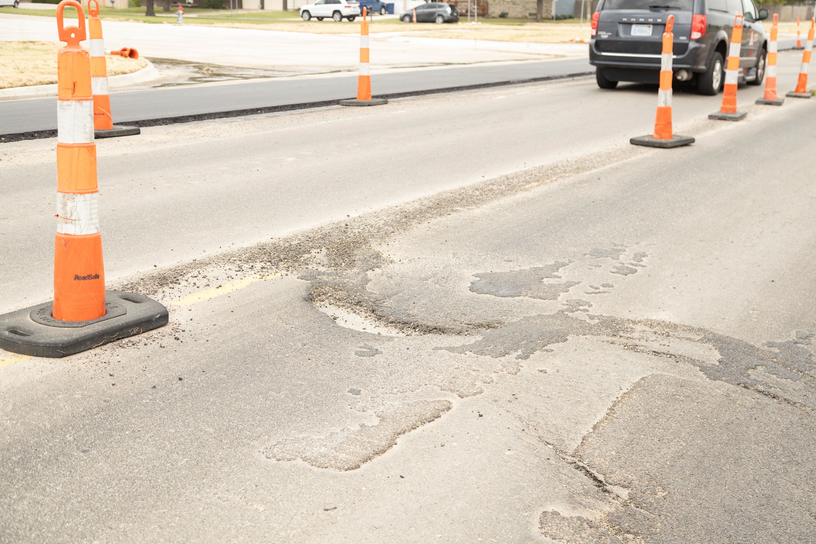 Defects during Woodlawn construction showing large cracks and potholes